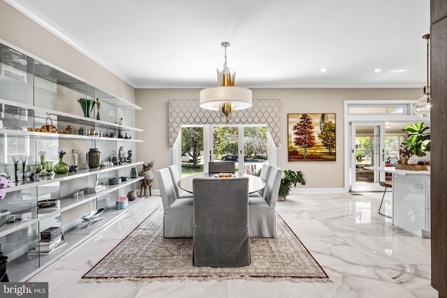 dining room with ornamental molding and french doors