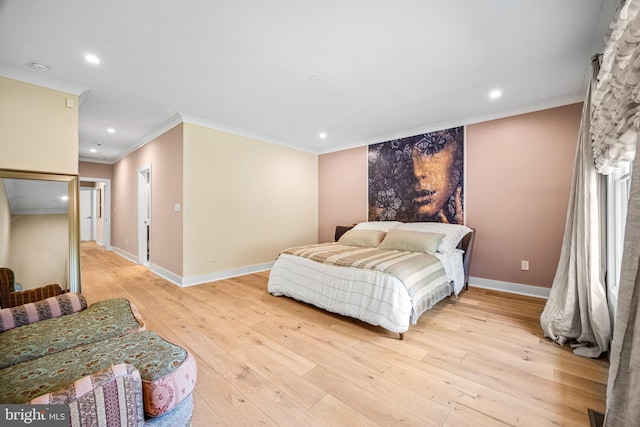 bedroom with ornamental molding and light hardwood / wood-style floors