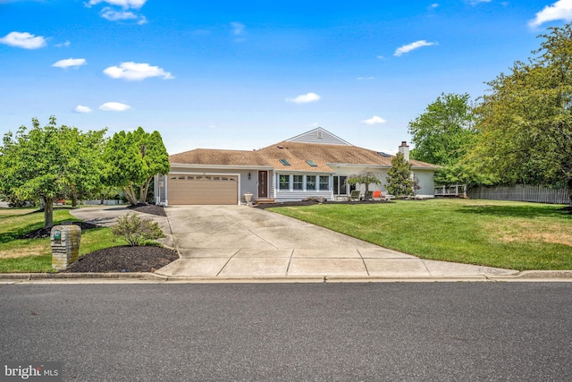 ranch-style house featuring a garage and a front lawn