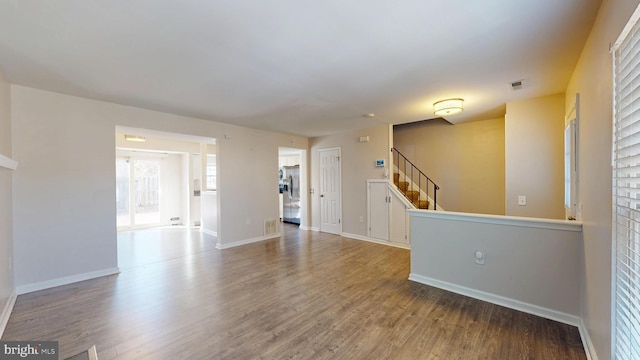 spare room featuring wood-type flooring