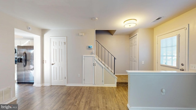 foyer entrance with hardwood / wood-style floors