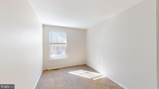 unfurnished room with light carpet