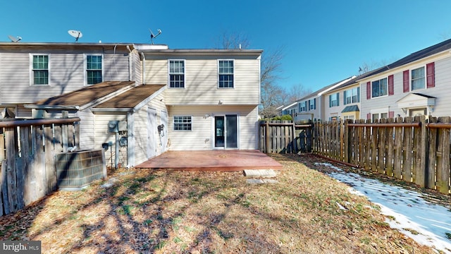 back of property with central air condition unit and a patio area