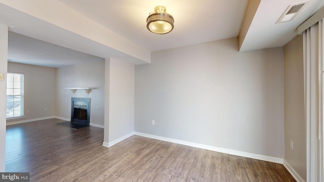 unfurnished living room with hardwood / wood-style floors