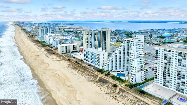 aerial view featuring a water view and a view of the beach