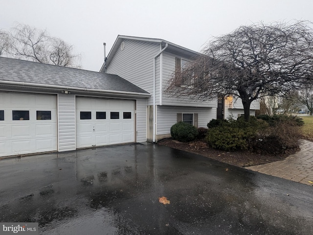 view of home's exterior with a garage