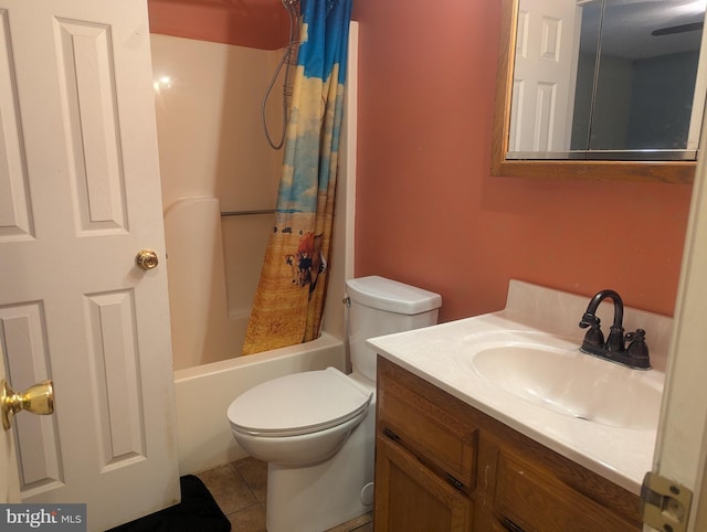 full bathroom with tile patterned flooring, vanity, toilet, and shower / bath combo with shower curtain