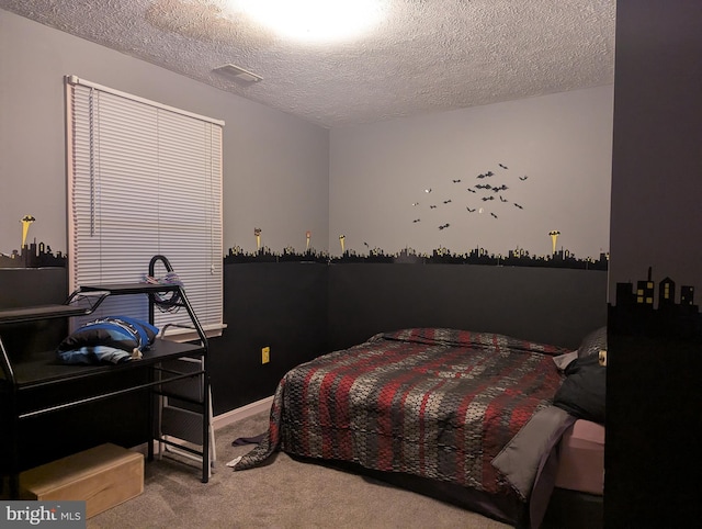 carpeted bedroom featuring a textured ceiling