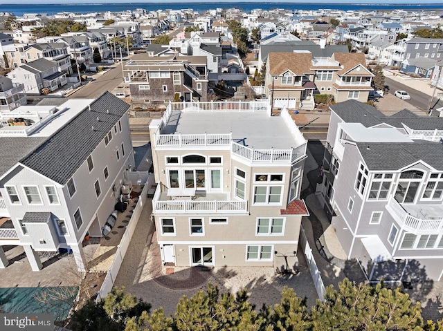 birds eye view of property with a residential view