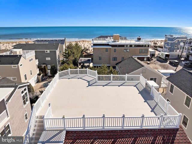 aerial view with a view of the beach and a water view