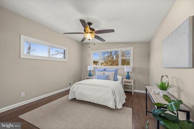 bedroom featuring dark hardwood / wood-style floors and ceiling fan