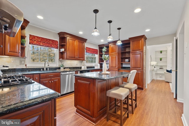 kitchen with open shelves, light wood-style flooring, stainless steel dishwasher, a sink, and ventilation hood