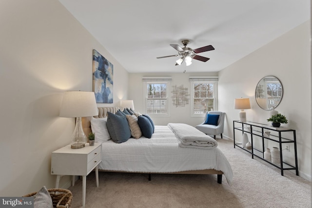 bedroom with ceiling fan, carpet floors, and baseboards