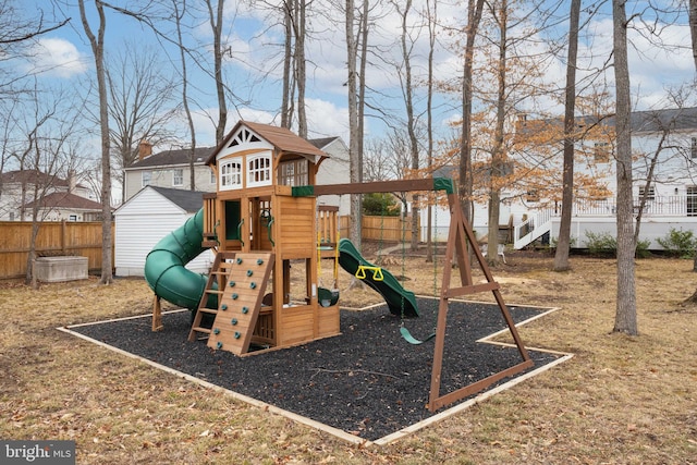 view of jungle gym featuring fence