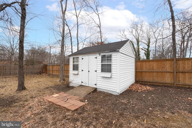 view of shed with a fenced backyard