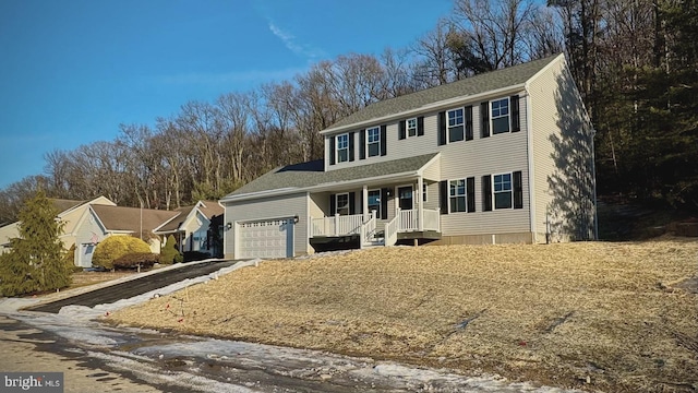 view of front of property with a garage and a porch