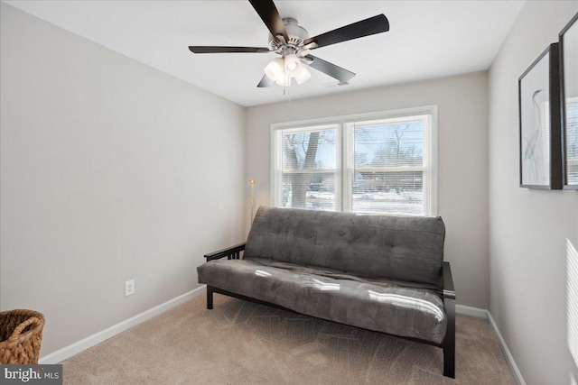 sitting room featuring ceiling fan and light carpet