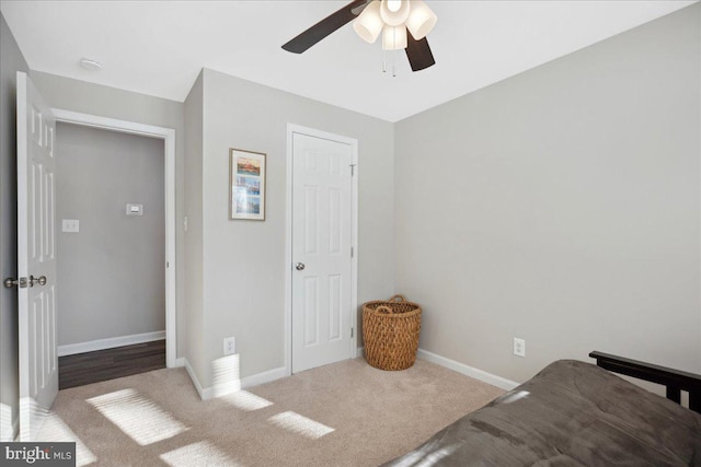 bedroom with ceiling fan and carpet flooring