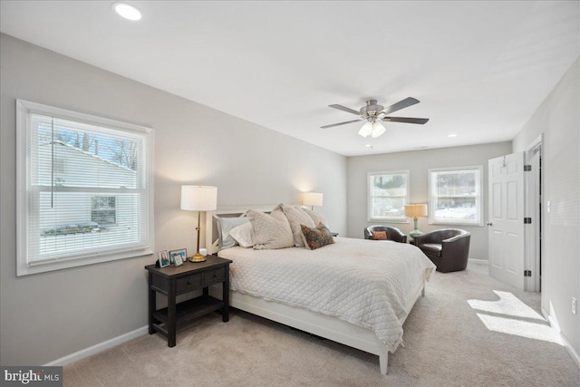 bedroom featuring light colored carpet and ceiling fan