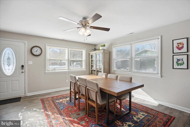 dining room featuring wood-type flooring and ceiling fan