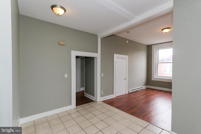 1812 Mcculloh St, Baltimore, MD 21217 - tiled empty room featuring a baseboard radiator, baseboards, and beamed ceiling