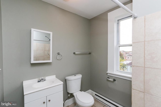1812 Mcculloh St, Baltimore, MD 21217 - bathroom featuring baseboard heating, toilet, vanity, baseboards, and a shower