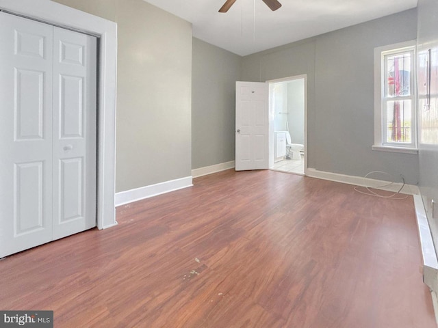 1812 Mcculloh St, Baltimore, MD 21217 - unfurnished bedroom featuring wood finished floors, baseboards, connected bathroom, and ceiling fan
