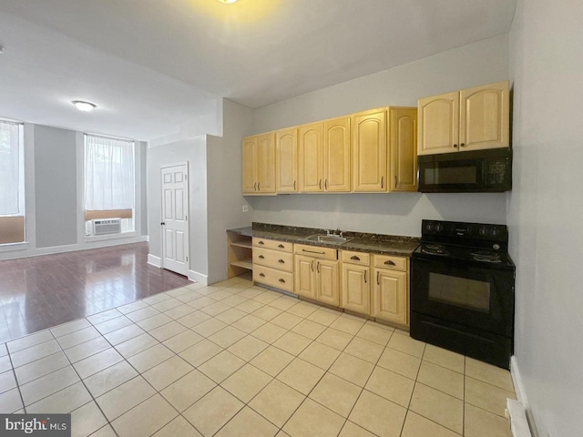 1812 Mcculloh St, Baltimore, MD 21217 - kitchen featuring black appliances, light brown cabinets, a sink, and dark countertops