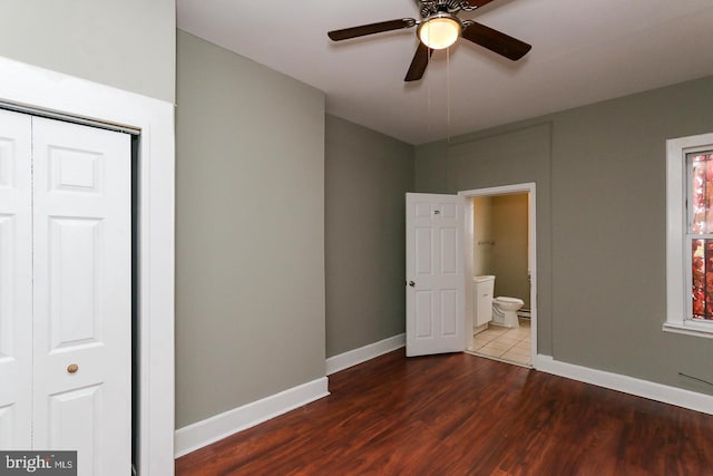1812 Mcculloh St, Baltimore, MD 21217 - unfurnished bedroom featuring wood finished floors, baseboards, ensuite bath, a closet, and a ceiling fan