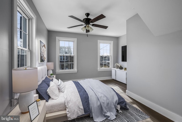 bedroom featuring hardwood / wood-style flooring and ceiling fan