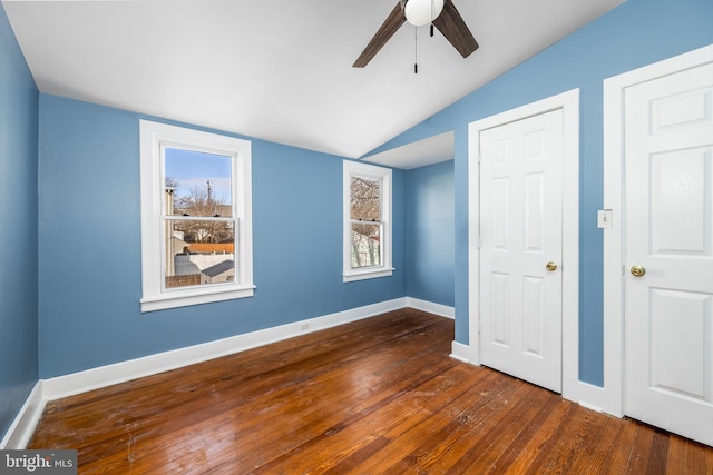 unfurnished bedroom with dark wood-type flooring, ceiling fan, and lofted ceiling