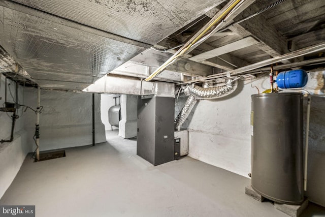 basement featuring heating unit and gas water heater