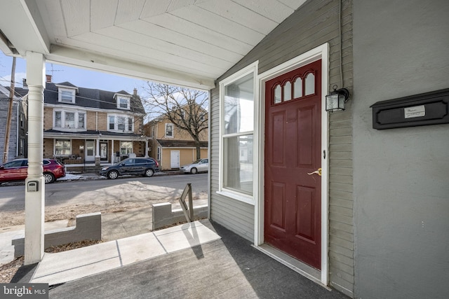 doorway to property featuring covered porch