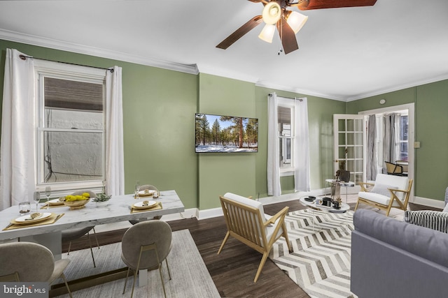 living room with dark hardwood / wood-style flooring, ornamental molding, and ceiling fan