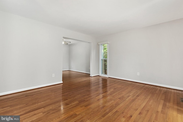 11501 Piney Lodge Rd, North Potomac, MD 20878 - empty room featuring wood finished floors and baseboards