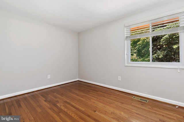 11501 Piney Lodge Rd, North Potomac, MD 20878 - spare room with baseboards and wood finished floors