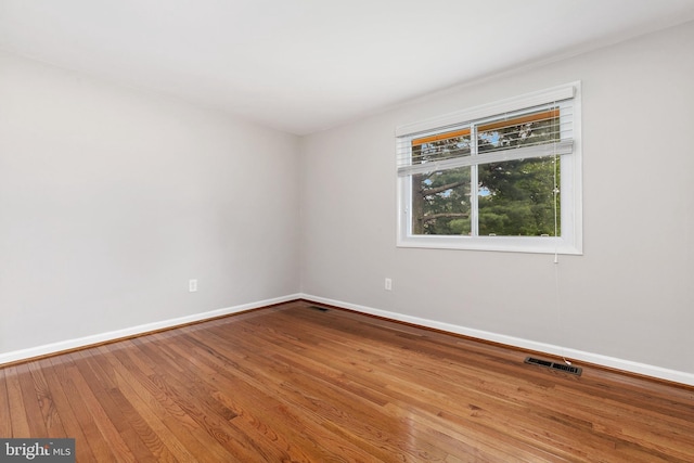 11501 Piney Lodge Rd, North Potomac, MD 20878 - empty room featuring wood finished floors and baseboards