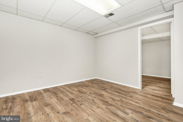 11501 Piney Lodge Rd, North Potomac, MD 20878 - unfurnished bedroom featuring a drop ceiling, wood finished floors, baseboards, and a closet