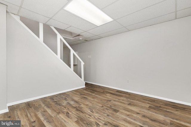 11501 Piney Lodge Rd, North Potomac, MD 20878 - finished basement featuring a drop ceiling, stairway, wood finished floors, and baseboards