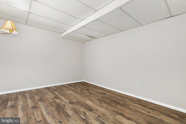 11501 Piney Lodge Rd, North Potomac, MD 20878 - spare room with a drop ceiling, baseboards, and dark wood-type flooring