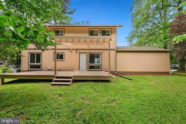 11501 Piney Lodge Rd, North Potomac, MD 20878 - rear view of property featuring a wooden deck, a lawn, and stucco siding