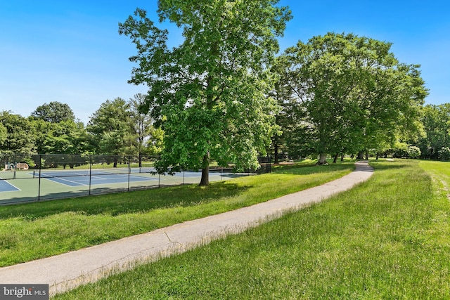 11501 Piney Lodge Rd, North Potomac, MD 20878 - view of property's community with a tennis court and view of wooded area