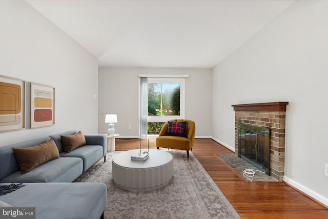 11501 Piney Lodge Rd, North Potomac, MD 20878 - living room with wood finished floors, a fireplace, and baseboards