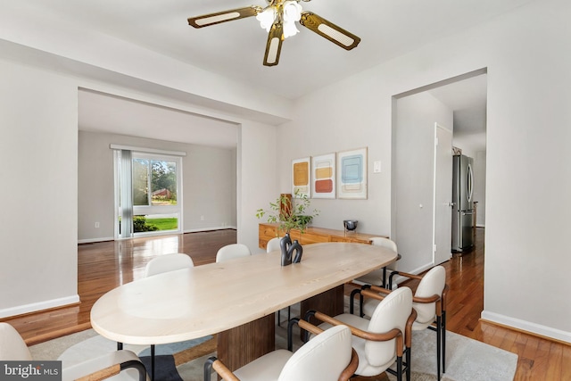 11501 Piney Lodge Rd, North Potomac, MD 20878 - dining space with wood finished floors, a ceiling fan, and baseboards