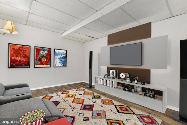 11501 Piney Lodge Rd, North Potomac, MD 20878 - living room featuring a paneled ceiling, wood finished floors, and baseboards