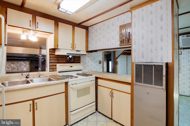 kitchen featuring white range with gas cooktop and sink