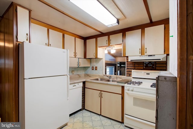 kitchen featuring sink and white appliances