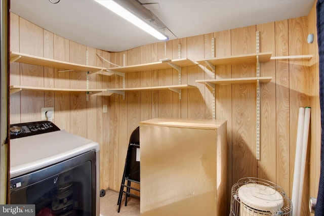 washroom featuring washer / clothes dryer and wooden walls