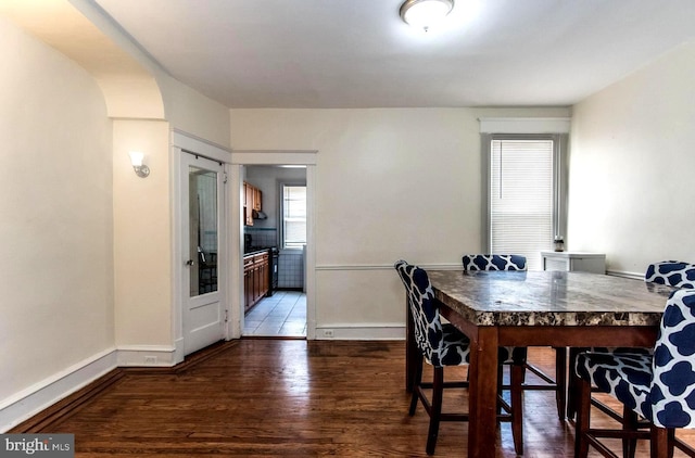 dining room with dark hardwood / wood-style floors