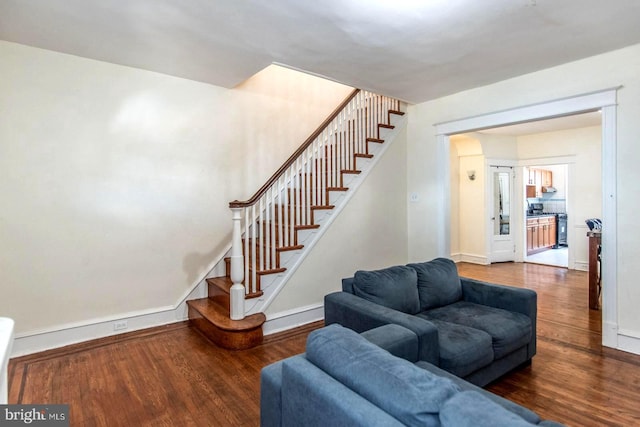 staircase with hardwood / wood-style floors